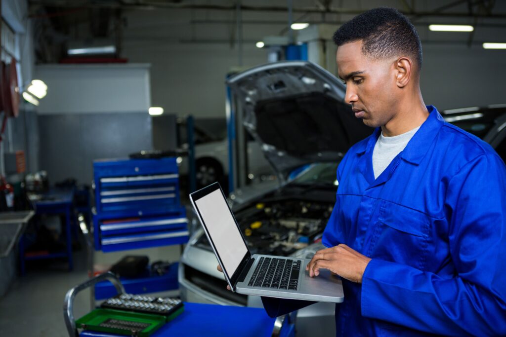 mechanic-working-laptop-min